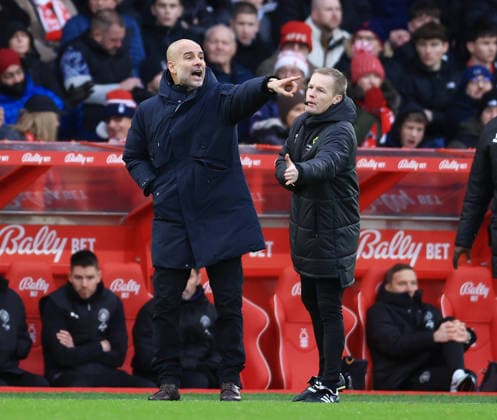 Nottingham, England, 27th December 2025. The fourth official attempts to pull back Pep Guardiola coach of Manchester City during the Nottingham Forest vs Manchester City Premier League match at the City Ground, Nottingham. Picture credit should read: Jessica Hornby Sportimage EDITORIAL USE ONLY. No use with unauthorised audio, video, data, fixture lists, club league logos or live services. Online in-match use limited to 120 images, no video emulation. No use in betting, games or single club league player publications. SPI_060_JH_Forest_ManC SPI-4395-0060