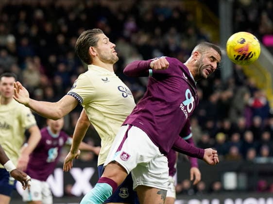 Burnley, England, 27th December 2025. James Tarkowski of Everton (l) challenges Kyle Walker of Burnley (r) during the Burnley vs Everton Premier League match at Turf Moor, Burnley. Picture credit should read: Andrew Yates Sportimage EDITORIAL USE ONLY. No use with unauthorised audio, video, data, fixture lists, club league logos or live services. Online in-match use limited to 120 images, no video emulation. No use in betting, games or single club league player publications. SPI_028_AY_Burnley_Everton SPI-4396-0028
