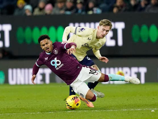Burnley, England, 27th December 2025. Marcus Edwards of Burnley brought down by James Garner of Everton during the Burnley vs Everton Premier League match at Turf Moor, Burnley. Picture credit should read: Andrew Yates Sportimage EDITORIAL USE ONLY. No use with unauthorised audio, video, data, fixture lists, club league logos or live services. Online in-match use limited to 120 images, no video emulation. No use in betting, games or single club league player publications. SPI_039_AY_Burnley_Everton SPI-4396-0039