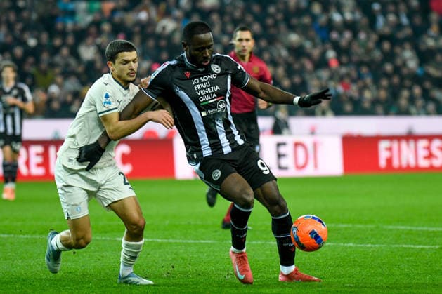 Udinese s Keinan Davis in action hindered by Lazio s Reda Belahyane during Udinese Calcio vs SS Lazio, Italian soccer Serie A match in Udine, Italy, December 27 2025  Copyright: xEttorexGriffoni IPAxSportx xipa-agency.netx xx IPA_69497999 IPA_Agency_IPA69497999