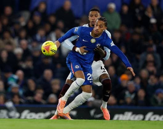 Joao Pedro of Chelsea competes for the ball with Ezri Konsa of Aston Villa Chelsea v Aston Villa, Football, Premier League, Stamford Bridge Stadium, London, UK - 27 12 2025 EDITORIAL USE ONLY No use with unauthorised audio, video, data, fixture lists (outside the EU), club league logos or live services. Online in-match use limited to 45 images (+15 in extra time). No use to emulate moving images. No use in betting, games or Copyright: xMattxImpey Shutterstockx 16214381k