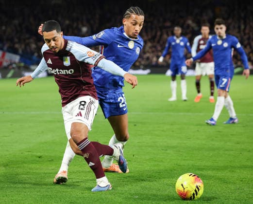 27th December 2025; Stamford Bridge, Chelsea, London, England: Premier League Football, Chelsea versus Aston Villa; Youri Tielemans of Aston Villa tackles Joao Pedro of Chelsea  IanxStephen