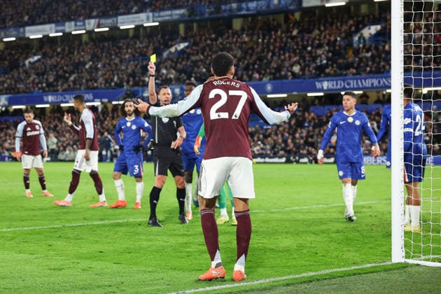27th December 2025; Stamford Bridge, Chelsea, London, England: Premier League Football, Chelsea versus Aston Villa; referee Stuart Atwell books Morgan Rogers of Aston Villa, yellow card  IanxStephen