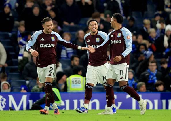 Ollie Watkins of Aston Villa (right) celebrates with teammates Matty Cash (left) and Jadon Sancho after scoring their side s second goal of the game Chelsea v Aston Villa, Premier League, Football, Stamford Bridge, London, UK - 27 Dec 2025London Stamford Bridge United Kingdom EDITORIAL USE ONLY No use with unauthorised audio, video, data, fixture lists, club league logos or live services. Online in-match use limited to 120 images, no video emulation. No use in betting, games or single club league player publications. Copyright: xGeorgexTewkesbury Shutterstockx 16213165br