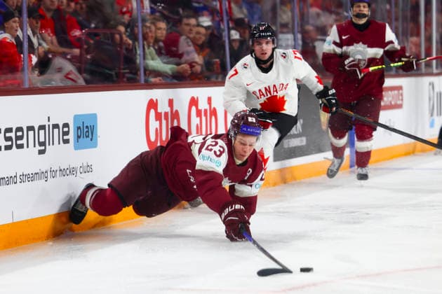 December 27, 2025, Minneapolis, Minnesota, United States: Latvia forward ALBERTS SMITS (23) dives for the puck. Canada and Latvia faced off in the opening round of the IIHF World Junior Championship on December 27th. Canada was victorious, winning 2-1 in overtime. Minneapolis United States - ZUMAt166 20251227_zsp_t166_012 Copyright: xMichaelxTurnerx