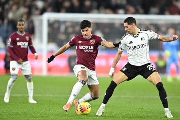 West Ham United v Fulham, Premier League West Ham United midfielder Mateus Fernandes (18) and Fulham midfielder Sasa Lukic (20) during the Premier League match between West Ham United and Fulham at the London Stadium, London, UK on 27 December 2025. London London Stadium UK Editorial use only DataCo restrictions apply See www.football-dataco.com , Copyright: xPaulxBockingx PSI-23477-0189