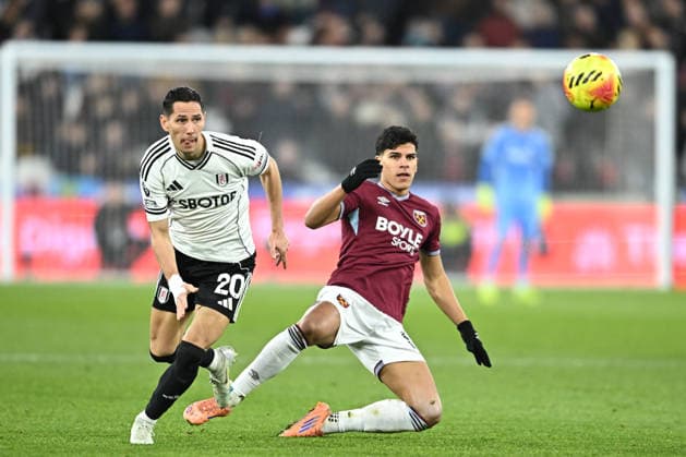 West Ham United v Fulham, Premier League West Ham United midfielder Mateus Fernandes (18) and Fulham midfielder Sasa Lukic (20) during the Premier League match between West Ham United and Fulham at the London Stadium, London, UK on 27 December 2025. London London Stadium UK Editorial use only DataCo restrictions apply See www.football-dataco.com , Copyright: xPaulxBockingx PSI-23477-0194