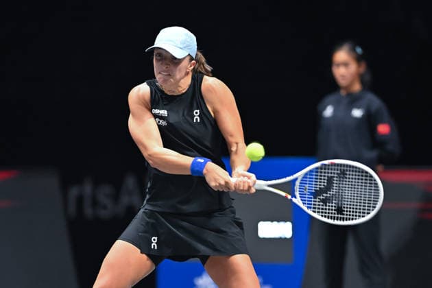 SHENZHEN, CHINA - DECEMBER 27: Iga Swiatek of Poland returns a shot in the Women s Singles match against Wang Xinyu of China on day 2 of the 2025 World Tennis Continental Cup at Shenzhen Universiade Center on December 27, 2025 in Shenzhen, Guangdong Province of China.  Copyright: xVCGx 111612196391