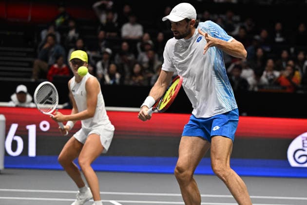 SHENZHEN, CHINA - DECEMBER 28: Iga Swiatek of Poland and Valentin Vacherot of Monaco return a shot in the Mixed Doubles match against Elena Rybakina of Kazakhstan and Andrey Rublev on day 3 of the 2025 World Tennis Continental Cup at Shenzhen Universiade Center on December 28, 2025 in Shenzhen, Guangdong Province of China.  Copyright: xVCGx 111612347924