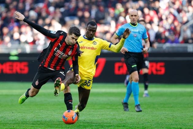 28th December2025; Stadio San Siro, Milan, Italy, Serie A Football, AC Milan versus Hellas Verona; Christian Pulisic of AC Milan under pressure from Cheikh Niasse of Hellas Verona FC  EmanuelexPennacchio