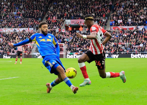 Sunderland v Leeds United Premier League Romaine Mundle of Sunderland is tackled by Jayden Bogle of Leeds United during the Premier League match at the Stadium of Light, Sunderland 28 12 2025 UK Newspapers OUT Copyright: xFredxPalmerx FIL-22706-0087