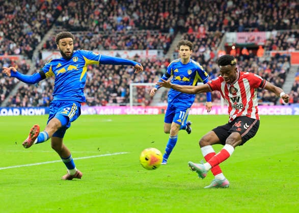 Sunderland v Leeds United Premier League Romaine Mundle of Sunderland is tackled by Jayden Bogle of Leeds United during the Premier League match at the Stadium of Light, Sunderland 28 12 2025 UK Newspapers OUT Copyright: xFredxPalmerx FIL-22706-0090