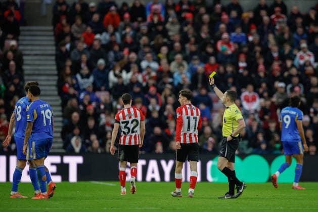 Sunderland v Leeds United, Premier League Trai Hume of Sunderland is shown a yellow card during the Premier League match between Sunderland and Leeds United at the Stadium Of Light, Sunderland, UK on 28 December 2025. Sunderland Stadium Of Light Tyne and Wear UK Editorial use only DataCo restrictions apply See www.football-dataco.com , Copyright: xCraigxCowanx PSI-23476-0118
