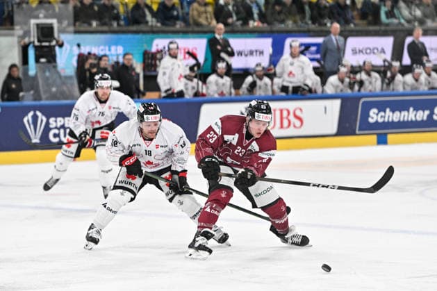 DAVOS, SWITZERLAND - DECEMBER 29: Pavel Kousal of Sparta Praha R) in action chased by Mason Shaw of Team Canada L) during the Spengler Cup Davos match between HC Sparta Praha v Team Canada at Zondacrypto-Arena on December 29, 2025 in Davos, Switzerland. Davos Graubunden Switzerland Copyright: xJustPictures.ch AndreaxBrancax jp-en-EuSpIm-AB_29122025_AAB_4651