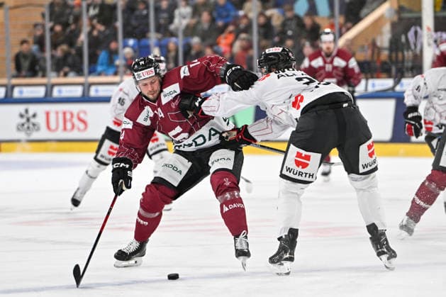 DAVOS, SWITZERLAND - DECEMBER 29: Filip Chlapik of Sparta Praha L) in a battle for the puck against Nolan Allan of Team Canada R) during the Spengler Cup Davos match between HC Sparta Praha v Team Canada at Zondacrypto-Arena on December 29, 2025 in Davos, Switzerland. Davos Graubunden Switzerland Copyright: xJustPictures.ch AndreaxBrancax jp-en-EuSpIm-AB_29122025_AAB_5280