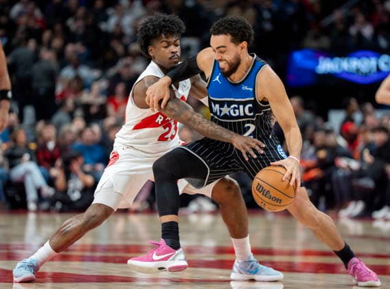 December 29, 2025, Toronto, On, Canada: Orlando Magic guard Tyus Jones (2) drives against Toronto Raptors guard Jamal Shead (23) during first half NBA, Basketball Herren, USA action in Toronto on Monday December 29, 2025. Canada News - December 29, 2025  - ZUMAc35_ 20251229_zaf_c35_059 Copyright: xFrankxGunnx