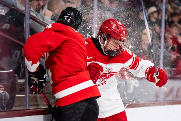 December 29, 2025, Minneapolis, Mn, Canada: Canada s Harrison Brunicke (4) and Denmark s Martinus Uggerhoj Schioldan (28) collide against the boards during during second period IIHF World Junior Championship hockey action in Minneapolis on Monday, Dec. 29, 2025. Canada News - December 29, 2025  - ZUMAc35_ 20251229_zaf_c35_065 Copyright: xChristopherxKatsarovx