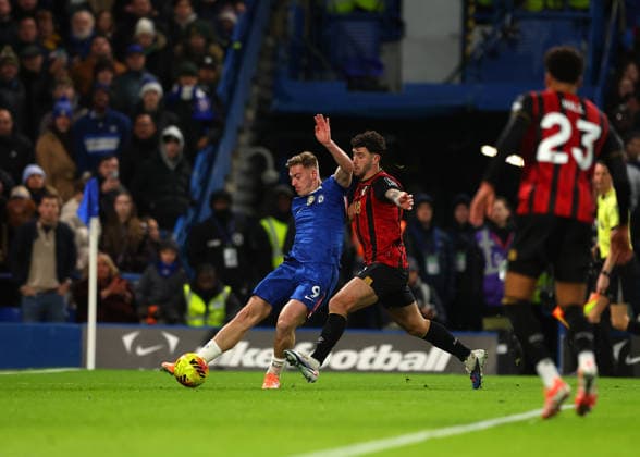 30th December 2025; Stamford Bridge, Chelsea, London, England: Premier League Football, Chelsea versus Bournemouth; Liam Delap of Chelsea challenged by Marcos Senesi of AFC Bournemouth  JohnxPatrickxFletcher