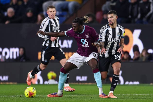 Burnley, England, 30th December 2025. Lesley Ugochukwu of Burnley holds off Bruno Guimaraes of Newcastle United during the Burnley vs Newcastle United Premier League match at Turf Moor, Burnley. Picture credit should read: Craig Thomas Sportimage EDITORIAL USE ONLY. No use with unauthorised audio, video, data, fixture lists, club league logos or live services. Online in-match use limited to 120 images, no video emulation. No use in betting, games or single club league player publications. SPI_043_CT_BURNLEY_V_NEWCASTLE_UNITED SPI-4401-0048