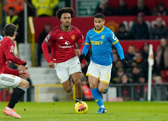 Manchester, England, 30th December 2025. Joshua Zirkzee of Manchester United, ManU (l) and Joao Gomes of Wolverhampton Wanderers (r) during the Manchester United vs Wolverhampton Wanderers Premier League match at Old Trafford, Manchester. Picture credit should read: Andrew Yates Sportimage EDITORIAL USE ONLY. No use with unauthorised audio, video, data, fixture lists, club league logos or live services. Online in-match use limited to 120 images, no video emulation. No use in betting, games or single club league player publications. SPI_030_AY_Man_Utd_Wolves SPI-4404-0031