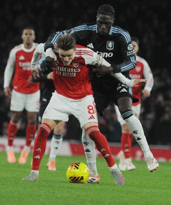 Football - 2025 2026 Premier League - Arsenal vs Aston Villa - Emirates Stadium - Tuesday 30th December 2025 Martin Odegaard of Arsenal and Amadou Onana of Villa 