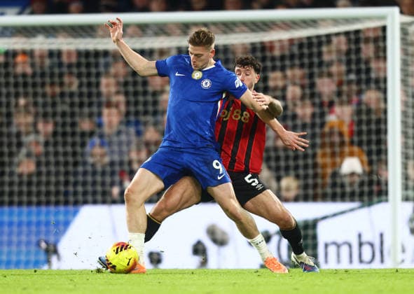 Liam Delap of Chelsea shields the ball from Marcos Senesi of Bournemouth during the Premier League game at Stamford Bridge , UK NEWSPAPERS OUT Copyright: xMarkxGreenwoodx