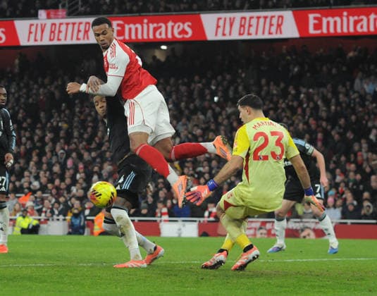 Football - 2025 2026 Premier League - Arsenal vs Aston Villa - Emirates Stadium - Tuesday 30th December 2025 Gabriel of Arsenal jumps above Emilio Martinez of Villa 