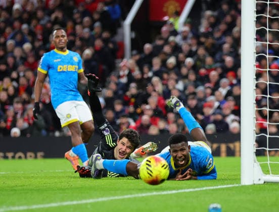 30th December 2025; Old Trafford, Manchester, England; Premier League Football, Manchester United, ManU versus Wolverhampton Wanderers; Goalkeeper Senne Lammens of Manchester United and Yerson Mosquera of Wolverhampton Wanderers  RogerxEvans