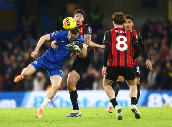 Chelsea v Bournemouth, English Premier League, Stamford Bridge, London, UK - 30 12 2025 Marcos Senesi of Bournemouth clears the ball from Liam Delap of Chelsea during the Premier League game at Stamford Bridge London Stamford Bridge London GBR, UK NEWSPAPERS OUT Copyright: xMarkxGreenwoodx