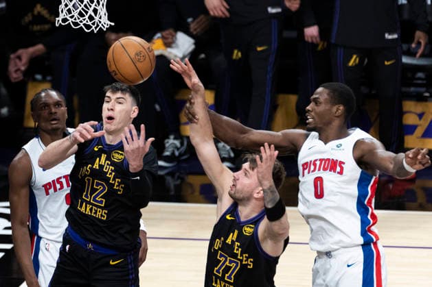 December 30, 2025, Los Angeles, California, USA: Detroit Pistons Jalen Duren (0) vies for the rebound against Los Angeles Lakers Jake LaRavia (12) and Luka DonÄÂiÄ¡ (77) during an NBA, Basketball Herren, USA basketball game on Tuesday, Dec. 30, 2025 in Los Angeles. Los Angeles USA - ZUMAc68_ 20251230_zaf_c68_024 Copyright: xRingoxChiux