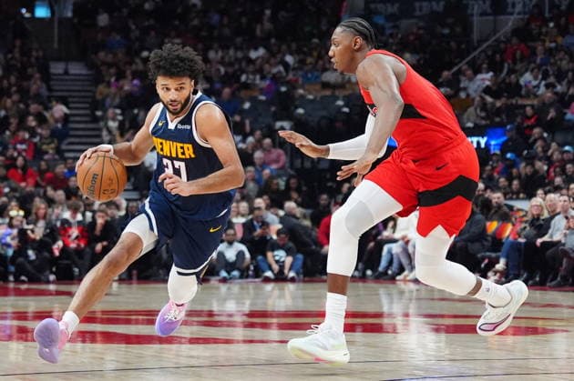 December 31, 2025, Toronto, On, CANADA: Denver Nuggets guard Jamal Murray (27) moves around Toronto Raptors forward guard RJ Barrett, right, during first half NBA, Basketball Herren, USA action in Toronto on Wednesday December 31, 2025. Canada News - December 31, 2025 - ZUMAc35_ 20251231_zaf_c35_074 Copyright: xFrankxGunnx