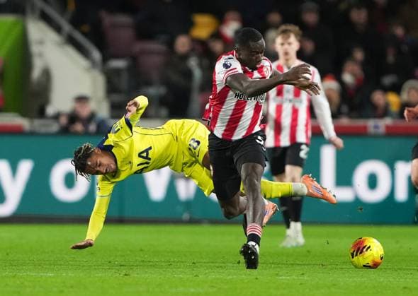 Michael Kayode of Brentford tackles Wilson Odobert of Tottenham Hotspur Brentford v Tottenham Hotspur, Premier League, Football, Gtech Community Stadium, London, UK - 01 Jan 2026London Gtech Community Stadium United Kingdom EDITORIAL USE ONLY No use with unauthorised audio, video, data, fixture lists, club league logos or live services. Online in-match use limited to 120 images, no video emulation. No use in betting, games or single club league player publications. Copyright: xJedxLeicester Shutterstockx 16216360e