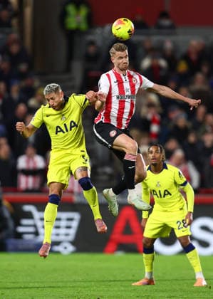 London, England, 1st January 2026. Richarlison of Tottenham Hotspur and Kristoffer Ajer of Brentford challenge for the ball during the Brentford vs Tottenham Hotspur Premier League match at Gtech Community Stadium, London. Picture credit should read: Paul Terry Sportimage EDITORIAL USE ONLY. No use with unauthorised audio, video, data, fixture lists, club league logos or live services. Online in-match use limited to 120 images, no video emulation. No use in betting, games or single club league player publications. SPI_025_PT_Brentford_Tottenham SPI-4425-0025