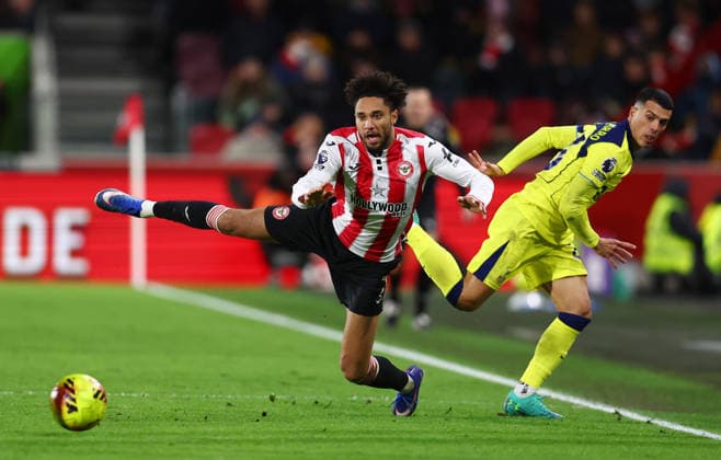 London, England, 1st January 2026. Kevin Schade of Brentford is fouled by Pedro Porro of Tottenham Hotspur during the Brentford vs Tottenham Hotspur Premier League match at Gtech Community Stadium, London. Picture credit should read: Paul Terry Sportimage EDITORIAL USE ONLY. No use with unauthorised audio, video, data, fixture lists, club league logos or live services. Online in-match use limited to 120 images, no video emulation. No use in betting, games or single club league player publications. SPI_027_PT_Brentford_Tottenham SPI-4425-0027