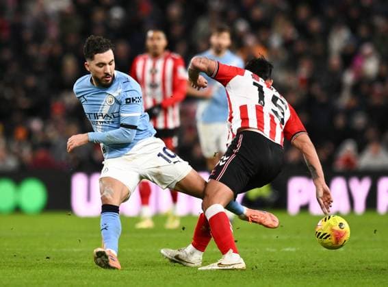 Rayan Cherki of Manchester City (left) challenges Omar Alderete of Sunderland Sunderland v Manchester City, Premier League, Football, Stadium of Light, Sunderland, UK - 01 Jan 2026Sunderland Stadium of Light United Kingdom EDITORIAL USE ONLY No use with unauthorised audio, video, data, fixture lists, club league logos or live services. Online in-match use limited to 120 images, no video emulation. No use in betting, games or single club league player publications.  Copyright: xRichardxLee Shutterstockx 16216366ao