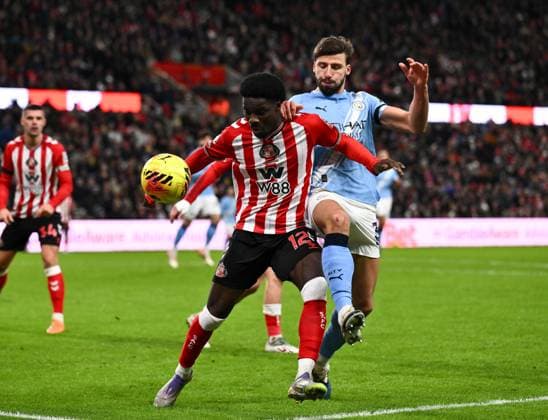 Eliezer Mayenda of Sunderland fends off Ruben Dias of Manchester City Sunderland v Manchester City, Premier League, Football, Stadium of Light, Sunderland, UK - 01 Jan 2026Sunderland Stadium of Light United Kingdom EDITORIAL USE ONLY No use with unauthorised audio, video, data, fixture lists, club league logos or live services. Online in-match use limited to 120 images, no video emulation. No use in betting, games or single club league player publications.  Copyright: xRichardxLee Shutterstockx 16216366ap