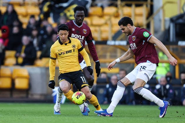 Wolverhampton, England, 3rd January 2026. Hwang Hee Chan of Wolverhampton Wanderers is tackled by Konstantinos Mavropanos of West Ham United during the Wolverhampton Wanderers vs West Ham United Premier League match at Molineux, Wolverhampton. Picture credit should read: Gareth Evans Sportimage EDITORIAL USE ONLY. No use with unauthorised audio, video, data, fixture lists, club league logos or live services. Online in-match use limited to 120 images, no video emulation. No use in betting, games or single club league player publications. SPI_015_GE_WOL_vs_WHU-3 SPI-4427-0017