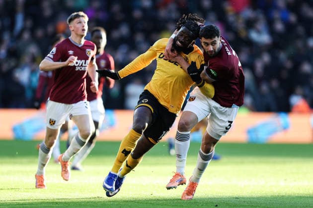 Wolverhampton, England, 3rd January 2026. Tolu Arokodare of Wolverhampton Wanderers and Max Kilman of West Ham United battle for the ball during the Wolverhampton Wanderers vs West Ham United Premier League match at Molineux, Wolverhampton. Picture credit should read: Gareth Evans Sportimage EDITORIAL USE ONLY. No use with unauthorised audio, video, data, fixture lists, club league logos or live services. Online in-match use limited to 120 images, no video emulation. No use in betting, games or single club league player publications. SPI_021_GE_WOL_vs_WHU SPI-4427-0021