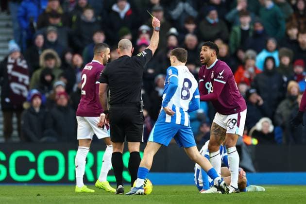 Josh Laurent of Burnley is shown a yellow card by Tim Robinson match referee Brighton and Hove Albion v Burnley, Premier League, Football, American Express Community Stadium, Brighton, UK - 03 Jan 2026Brighton American Express Community Stadi United Kingdom EDITORIAL USE ONLY No use with unauthorised audio, video, data, fixture lists, club league logos or live services. Online in-match use limited to 120 images, no video emulation. No use in betting, games or single club league player publications. Copyright: xSimonxDael Shutterstockx 16220497o