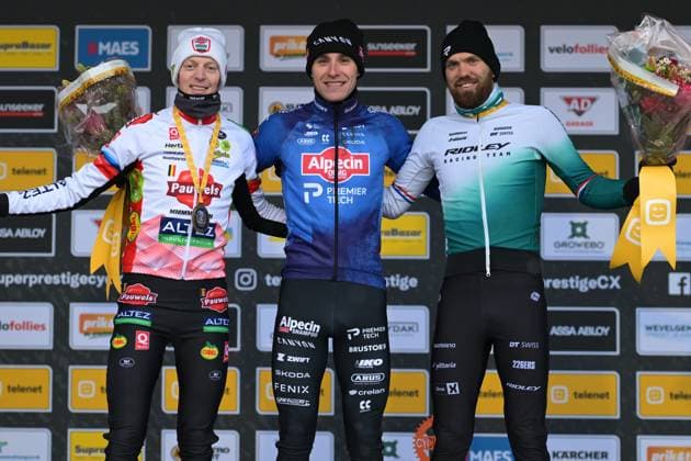 Belgian Michael Vanthourenhout, Belgian Niels Vandeputte and Dutch Joris Nieuwenhuis pictured on the podium after the men elite race at the cyclocross cycling event in Gullegem on Saturday 03 January 2026, stage 7 8 in the Superprestige cyclocross cycling competition DAVIDxPINTENS  x153293886x