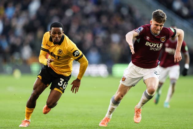 Wolverhampton, England, 3rd January 2026. Jackson Tchatchoua of Wolverhampton Wanderers and Oliver Scarles of West Ham United run for the ball during the Wolverhampton Wanderers vs West Ham United Premier League match at Molineux, Wolverhampton. Picture credit should read: Gareth Evans Sportimage EDITORIAL USE ONLY. No use with unauthorised audio, video, data, fixture lists, club league logos or live services. Online in-match use limited to 120 images, no video emulation. No use in betting, games or single club league player publications. SPI_037_GE_WOL_vs_WHU SPI-4427-0036