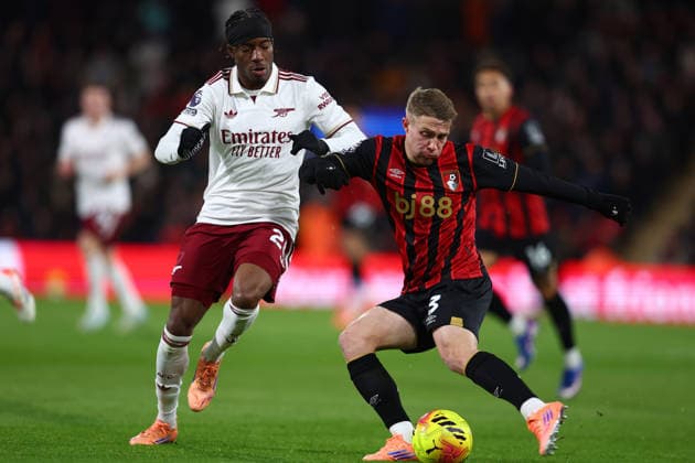 Bournemouth, England, 3rd January 2026. Noni Madueke of Arsenal and Adrien Truffert of Bournemouth challenge for the ball during the AFC Bournemouth vs Arsenal Premier League match at the Vitality Stadium, Bournemouth. Picture credit should read: Paul Terry Sportimage EDITORIAL USE ONLY. No use with unauthorised audio, video, data, fixture lists, club league logos or live services. Online in-match use limited to 120 images, no video emulation. No use in betting, games or single club league player publications. SPI_020_PT_Bournemouth_Arsenalx SPI-4428-0030