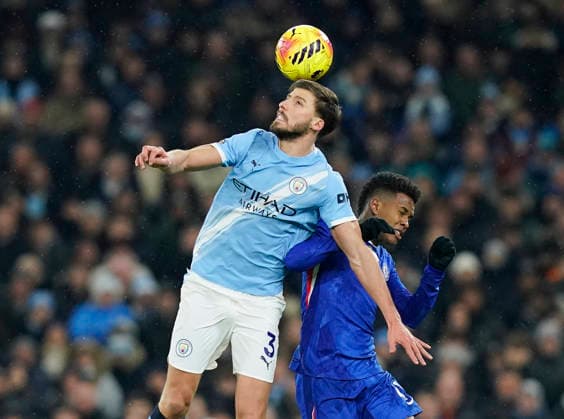 Manchester, England, 4th January 2026. Ruben Dias of Manchester City tussles with Estevao of Chelsea during the Manchester City vs Chelsea Premier League match at the Etihad Stadium, Manchester. Picture credit should read: Andrew Yates Sportimage EDITORIAL USE ONLY. No use with unauthorised audio, video, data, fixture lists, club league logos or live services. Online in-match use limited to 120 images, no video emulation. No use in betting, games or single club league player publications. SPI_046_AY_Man_City_Chelsea SPI-4432-0045
