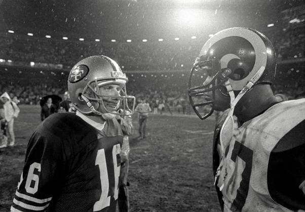 December 27, 1987 - San Francisco, California, U.S - San Francisco 49ers vs Los Angles Rams at Candlestick Park Sunday, December 27, 1987. 49ers beat LA Rams 48-0. San Francisco 49ers Quarterback Joe Montana (16) and Los Angles Rams Defensive End Gary Jeter Copyright: xAlxGolubx