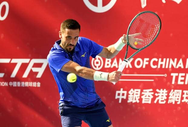 (260105) -- HONG KONG, Jan. 5, 2026 -- Damir Dzumhur hits a return during the men s singles round of 32 match between Nuno Borges of Portugal and Damir Dzumhur of Bosnia and Herzegovina (BiH) at the ATP, Tennis Herren Hong Kong Open tennis tournament in Hong Kong, China, Jan. 5, 2026. ) (SP)CHINA-HONG KONG-TENNIS-ATP HONG KONG OPEN (CN) LoxPingxFai 