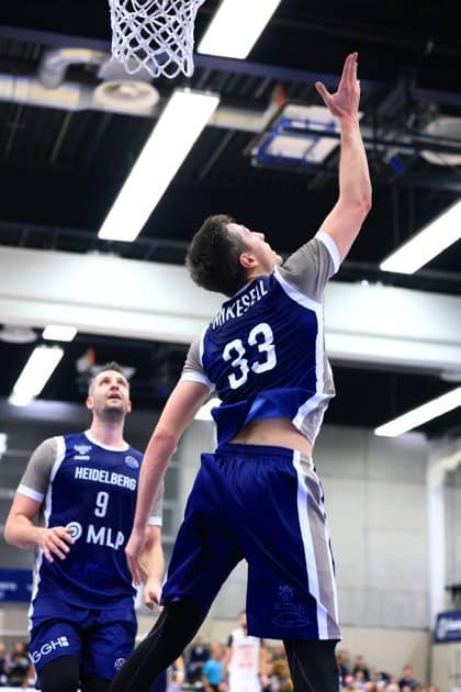 RECORD DATE NOT STATED Spielaktion mit Ryan Mikesell (33; MLP Academics Heidelberg) und Paul Zipser (9; MLP Academics Heidelberg) Basketball Champions League: MLP Academics Heidelberg – ERA Basketball Nymburk Ryan Mikesell (33; MLP Academics Heidelberg) mit Wurf