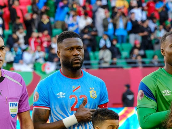 Chancel mbembadisplays patriotism during DR Congo national anthem RABAT, MOROCCO - JANUARY 22: Chancel mbemba of DR Congo stands with his hand over his heart during the national anthem before the AFCON 2025 Round of 16 match against Algeria at Stade Moulay El Hassan on January 06, 2026. The winger s focused expression reflects the importance of the knockout encounter for the Leopards