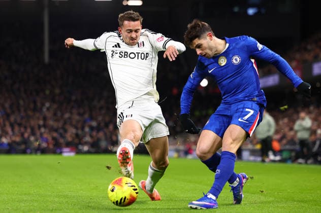 London, England, 7th January 2026. Timothy Castagne of Fulham and Pedro Neto of Chelsea challenge for the ball during the Fulham vs Chelsea Premier League match at Craven Cottage, London. Picture credit should read: Paul Terry Sportimage EDITORIAL USE ONLY. No use with unauthorised audio, video, data, fixture lists, club league logos or live services. Online in-match use limited to 120 images, no video emulation. No use in betting, games or single club league player publications. SPI_035_PT_Fulham_Chelsea SPI-4434-0035