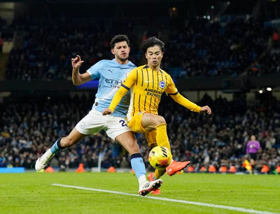 Manchester, England, 7th January 2026. Matheus Nunes of Manchester City and Kaoru Mitoma of Brighton during the Manchester City vs Brighton and Hove Albion Premier League match at the Etihad Stadium, Manchester. Picture credit should read: Andrew Yates Sportimage EDITORIAL USE ONLY. No use with unauthorised audio, video, data, fixture lists, club league logos or live services. Online in-match use limited to 120 images, no video emulation. No use in betting, games or single club league player publications. SPI_040_AY_Man_City_Brighton SPI-4435-0040