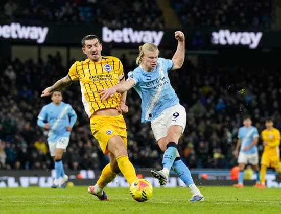 Manchester, England, 7th January 2026. Lewis Dunk of Brighton tackles Erling Haaland of Manchester City as he shoots during the Manchester City vs Brighton and Hove Albion Premier League match at the Etihad Stadium, Manchester. Picture credit should read: Andrew Yates Sportimage EDITORIAL USE ONLY. No use with unauthorised audio, video, data, fixture lists, club league logos or live services. Online in-match use limited to 120 images, no video emulation. No use in betting, games or single club league player publications. SPI_055_AY_Man_City_Brighton SPI-4435-0055